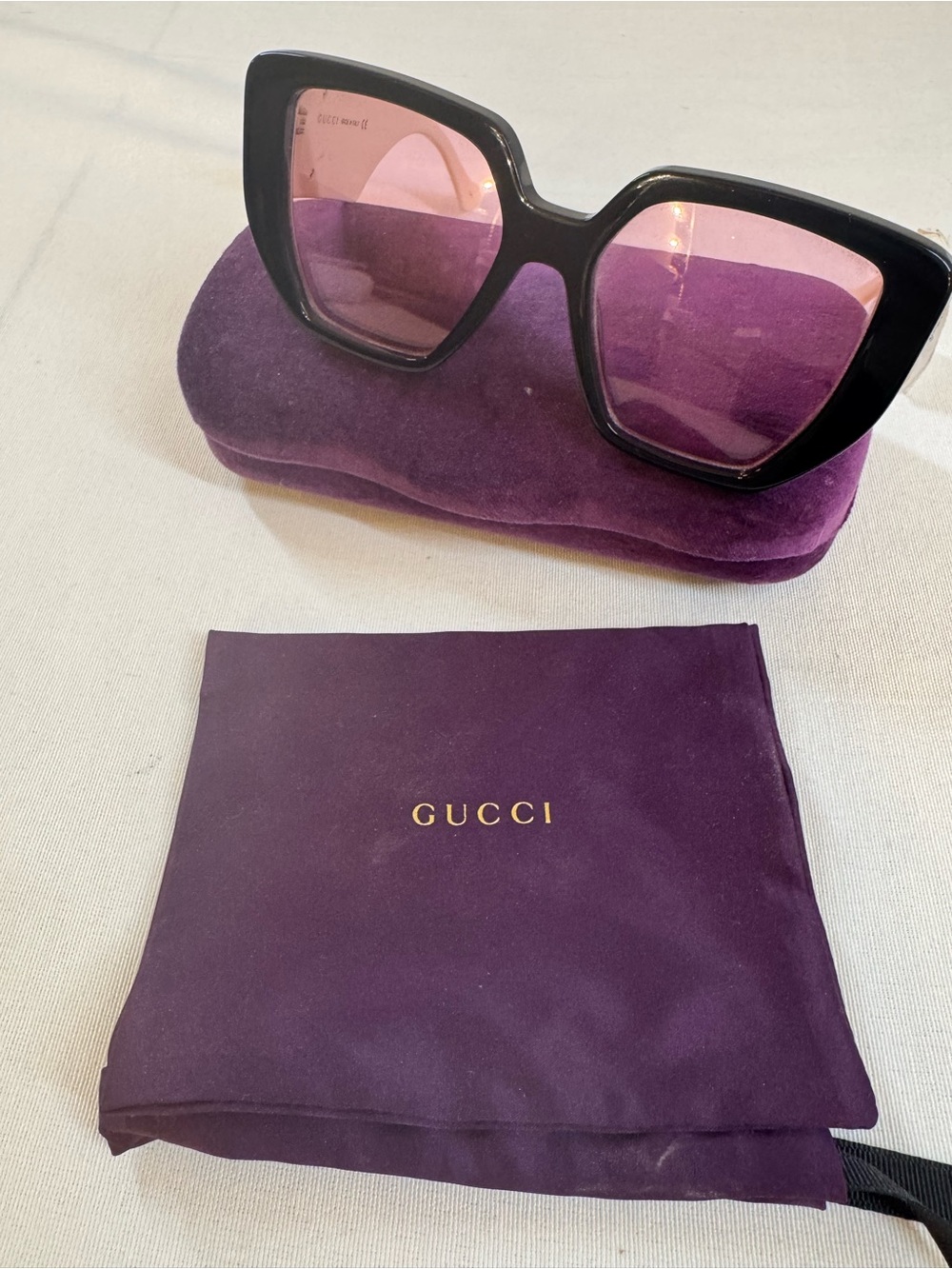 Gucci Women’s Black Frame Sunglasses with Purple Lenses and Purple Case